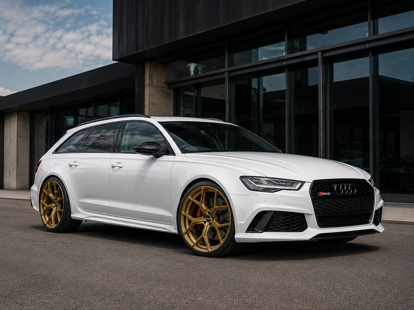 White Audi RS6 fitted with 22 inch Limited Edition Bronze-Gold alloy wheels parked outside a modern luxury building